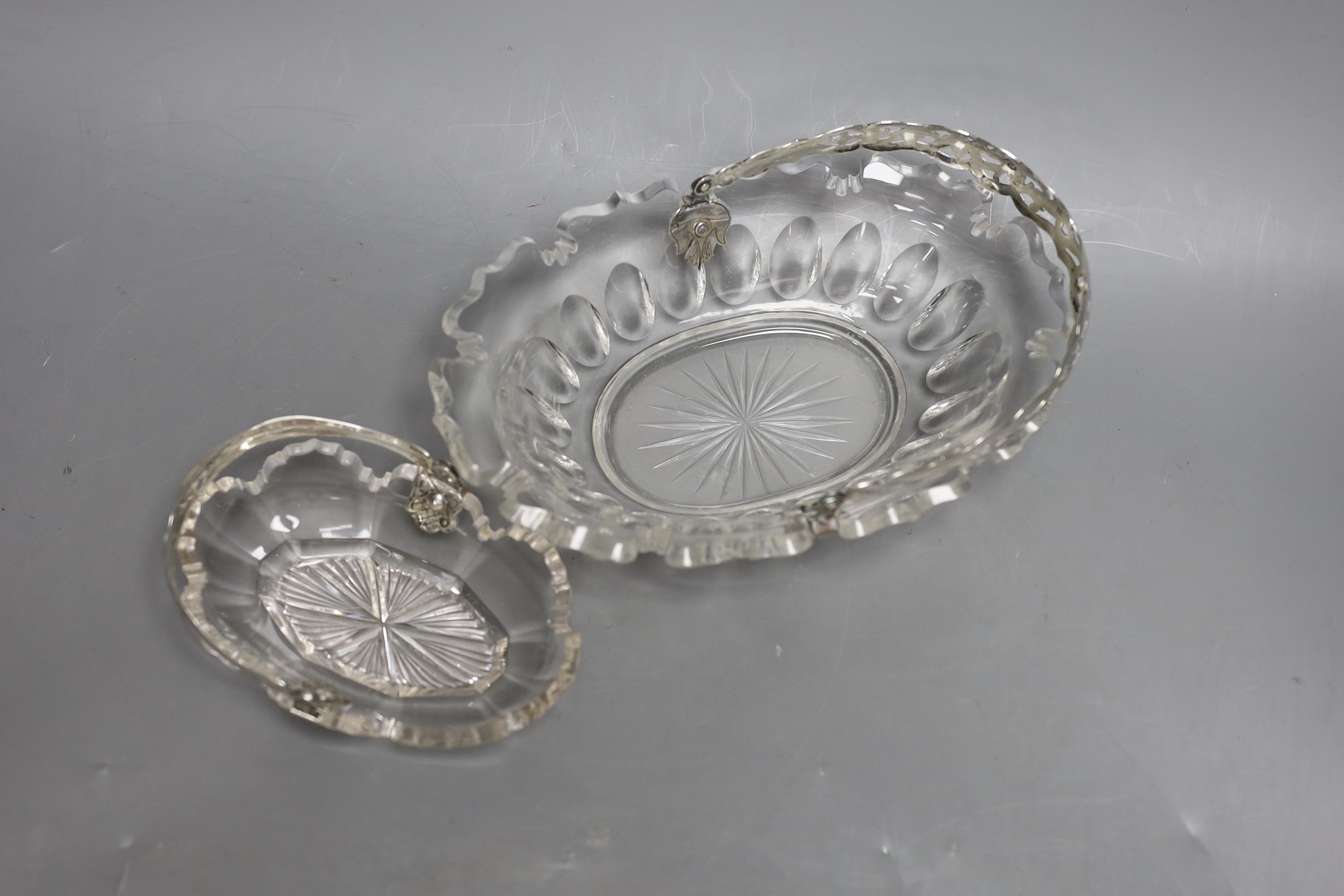 Two Victorian cut glass baskets with silver handles, largest 21cm long